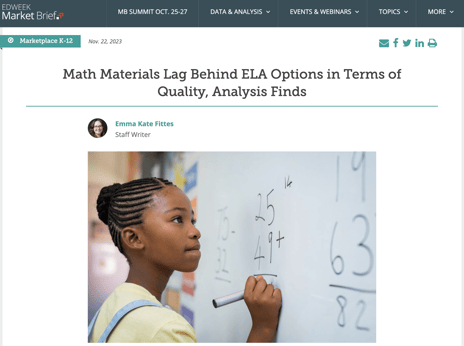 student completing math equation on whiteboard