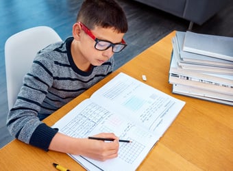 youth boy doing math homework